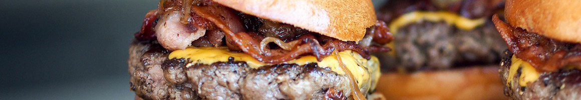 Eating Burger at Mighty Fine Burgers restaurant in Cedar Park, TX.